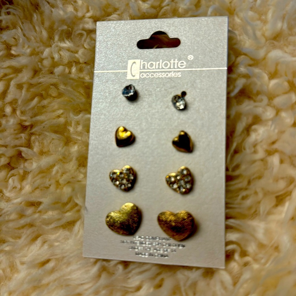 4 pairs of coordinated gold tone post earrings. Never worn.